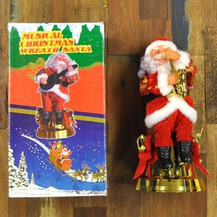POHYBLIVÝ SANTA CLAUS SE SAXOFONEM (2 ks)